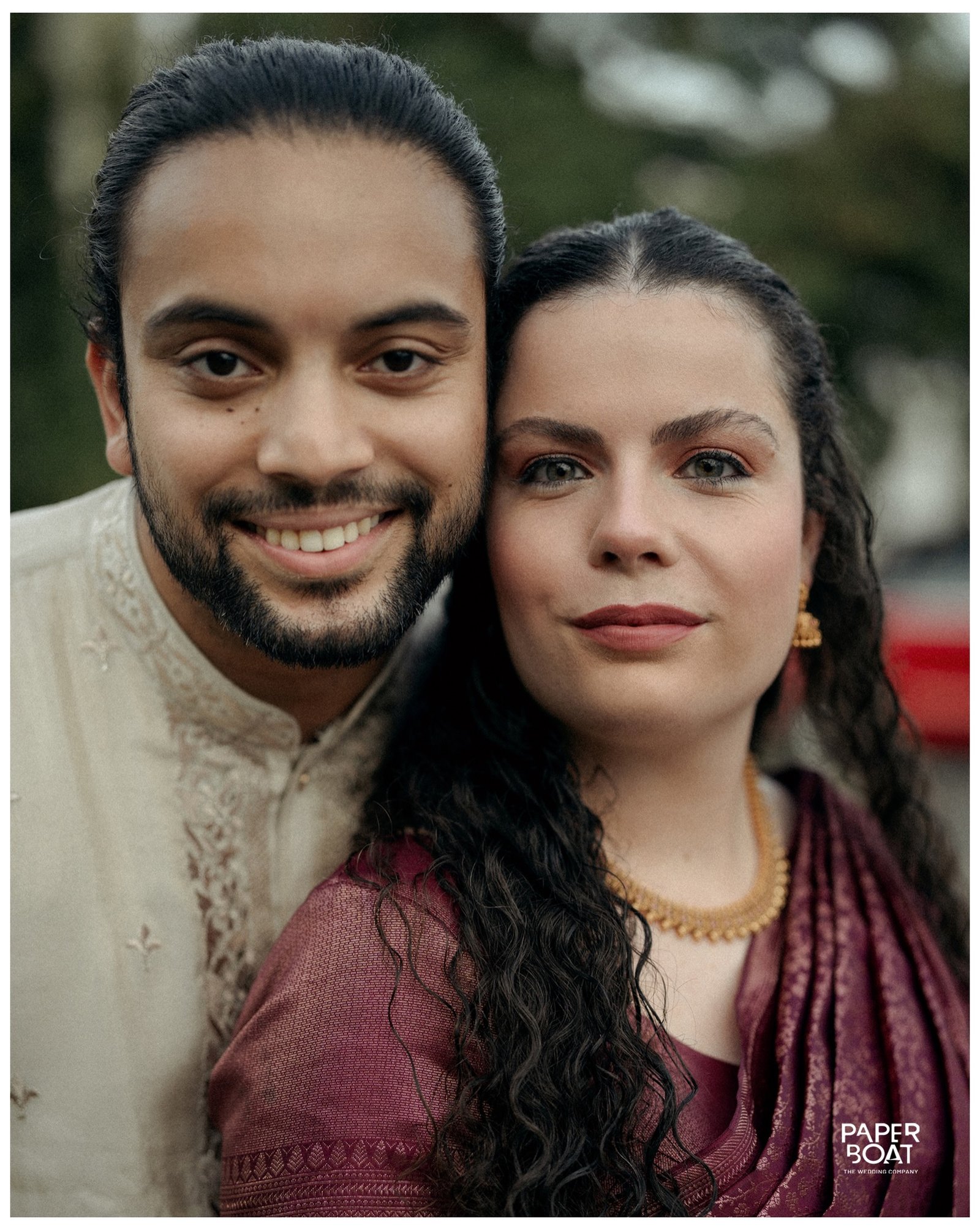 A couple smiling together in a close portrait