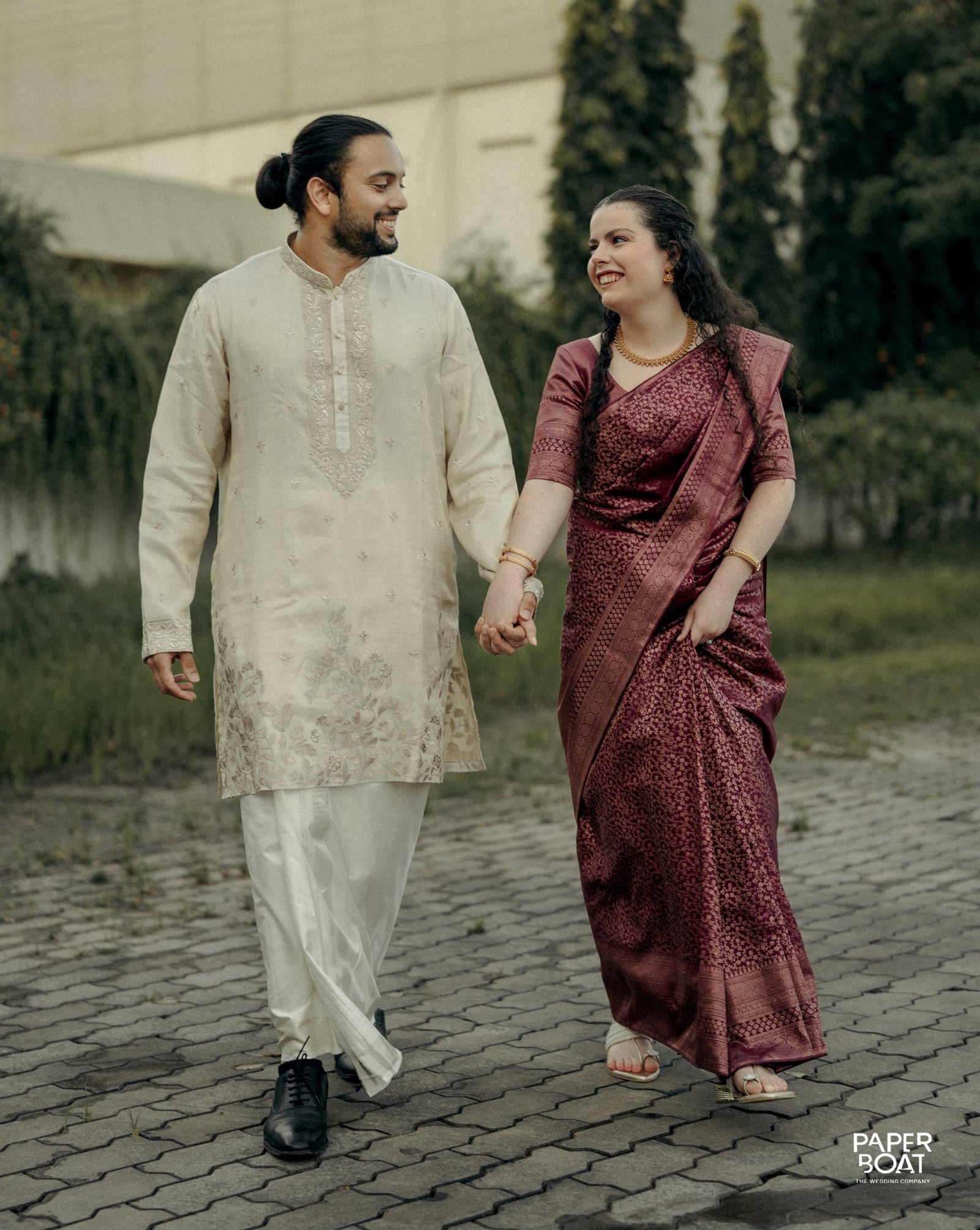 A couple walking together in traditional attire